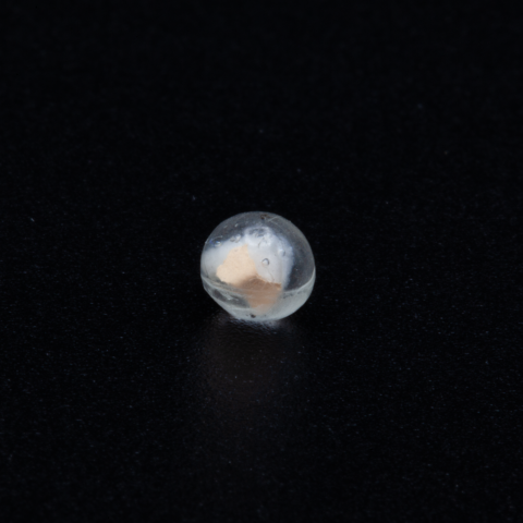 Spironolactone fragment encased in resin